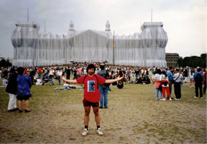 Ted with Christo wrapped building near berlin Wall in Germany.