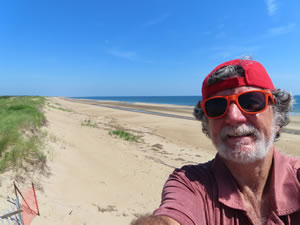 Ted with view of beach from wild life viewing tower near Pines rail parking lot (lot 5) on Plum Island (Parker River National Wildlife Refuge), Massachusetts.