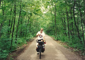 Chuck cycling the Kal-Haven bike trial with his camping gear. 