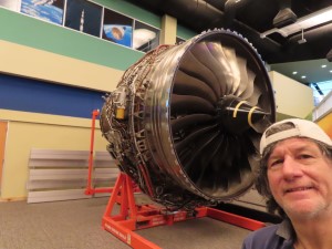 Ted with rocket engine behind him at NASA Stennis Visitor Center in Mississippi.