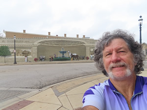 Ted in front of building with mural on building in Miamisburg, Ohio.