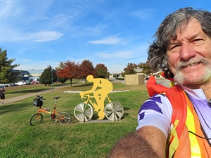 Ted and his bike with a trail side sculpture seen from the Chattanooga river trail.