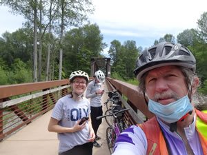 Natalie and Caleigh behind Ted on Olympic Discovery trial Railroad bridge near Sequim.