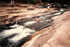 Ted sliding down the algae at Slide Rock in Oak Canyon near Sedona, Arizona.