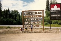 Ted in front of the sign to Alaska, 240 KM (150 miles to go).
