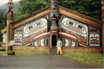 Ted in front of tribal house at Totem Bright Park near Ketchikan, Alaska.