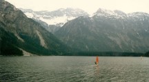 Wind surfer in ice cold lake in the Austrian Alps 