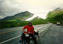 Ted on his bike with Worthington glacier in the background near Thompson Pass in the Chugach Mountains, Alaska.