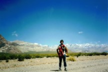 Ted on the road that follows mountains that are about 20,000 feet high. Ted is standing on the back highway to San Juan.