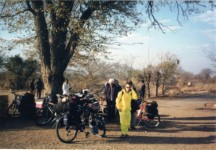My bike next to Becky in the parking lot to Victoria Falls.  Becky is wearing her bright yellow rain suit for the mist coming off the falls.  It was not very wet.