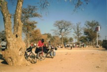 Karen looking at her bike by the turn off to Dete.  Teds bike is the one that is farthest back.