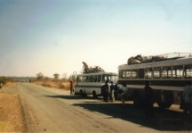 Shingi is loading one of our bikes on the small bus.  Our group went from the bus (front bus) with the blow out to the smaller bus (back bus).