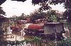 A houseboat on a river a little north of Bangkok, Thailand.