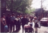 People gathered around Ted's bike near Summer Palace.