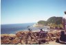 Ted's bike at viewpoint on highway 101 with view of Heceta Head lighthouse in the background.