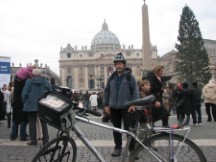 Rome - Ted with his bike in front of the Vatican with Christmas Mass about to start.