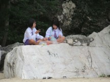 Girls in their school uniforms on the beach south of Hua Hin, Thailand