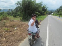 Passing motor scooter in Thailand