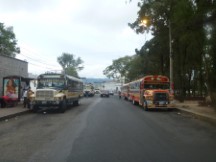 Man peeing on bus tire in Guatemala City