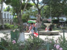 Lady carrying food to sell on her head in Antigua, Guatemala