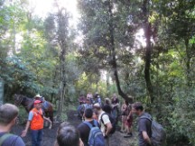 Guide (in orange vest) and other people on guided hike up Volcano Pacaya