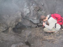 Man cooking Marshmallow over heat vent on Volcano Pacaya