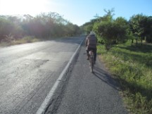 Man carrying a machete on his bike in Honduras