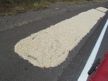 Corn kernels drying on the road in Nicaragua