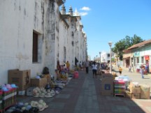 People selling souvenirs near church at square in Leon, Nicaragua