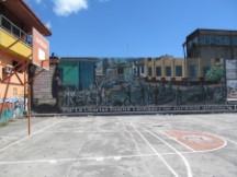 Mural of military-civilian conflict in Leon, Nicaragua.Might be in memory of Contra war.