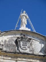 Statue with ladders on top of a church in Leon, Nicaragua.