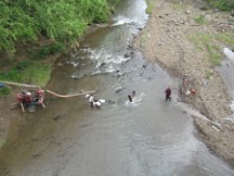 People cleaning up in river in Nicaragua