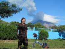 Ted and his bike with Volcano Concepcion in background in Nicaragua.