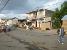 People running an electric line in Granada, Nicaragua