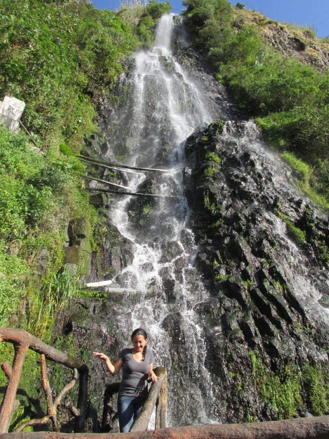 Lady at waterfall in Banos, Ecuador