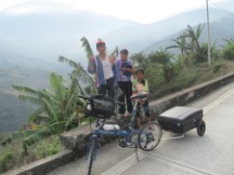 People near Ted’s bike at near 7,000 feet above sea level in Ecuador.