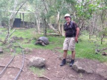Ted with Tortes behind him on Isle Santa Maria, Ecuador.