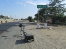 Ted’s bike in front of the sigh for the small town of San Jose, Peru.
