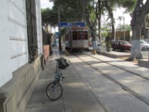 Ted’s bike with trolley car behind it in the Barranco district of Lima, Peru.