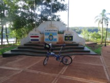 Ted’s bike at monument in Puerto Iguazu, Argentina.