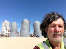 Ted and his bike at the “Hand in the Sand” in Punta del Este, Uruguay.