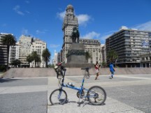 Ted’s bike in front of a statue and building in Montevideo, Uruguay.  
