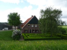 Netherlands – House with trimmed bush garden.