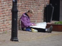 Netherlands – Janneke reading her map near glass blowing area of Leerdam.