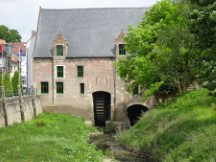 Belgium – Water wheel in building.