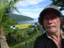 Ted at welcome sign to Panama near La Miel, Panama.