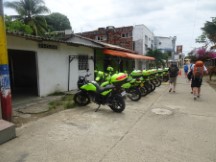 Police station at Necoclí, Colombia with Matt and Andrew (with backpacks in front of Ted)