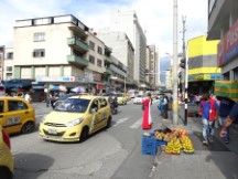 Man in red dress near city center of Medellin, Colombia.