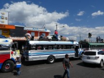 Loading the top of a bus in Quetzaltenango, Guatemala.