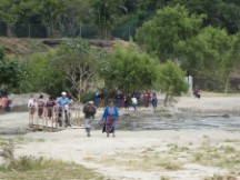 People crossing bridge to Panajachel, Guatemala.